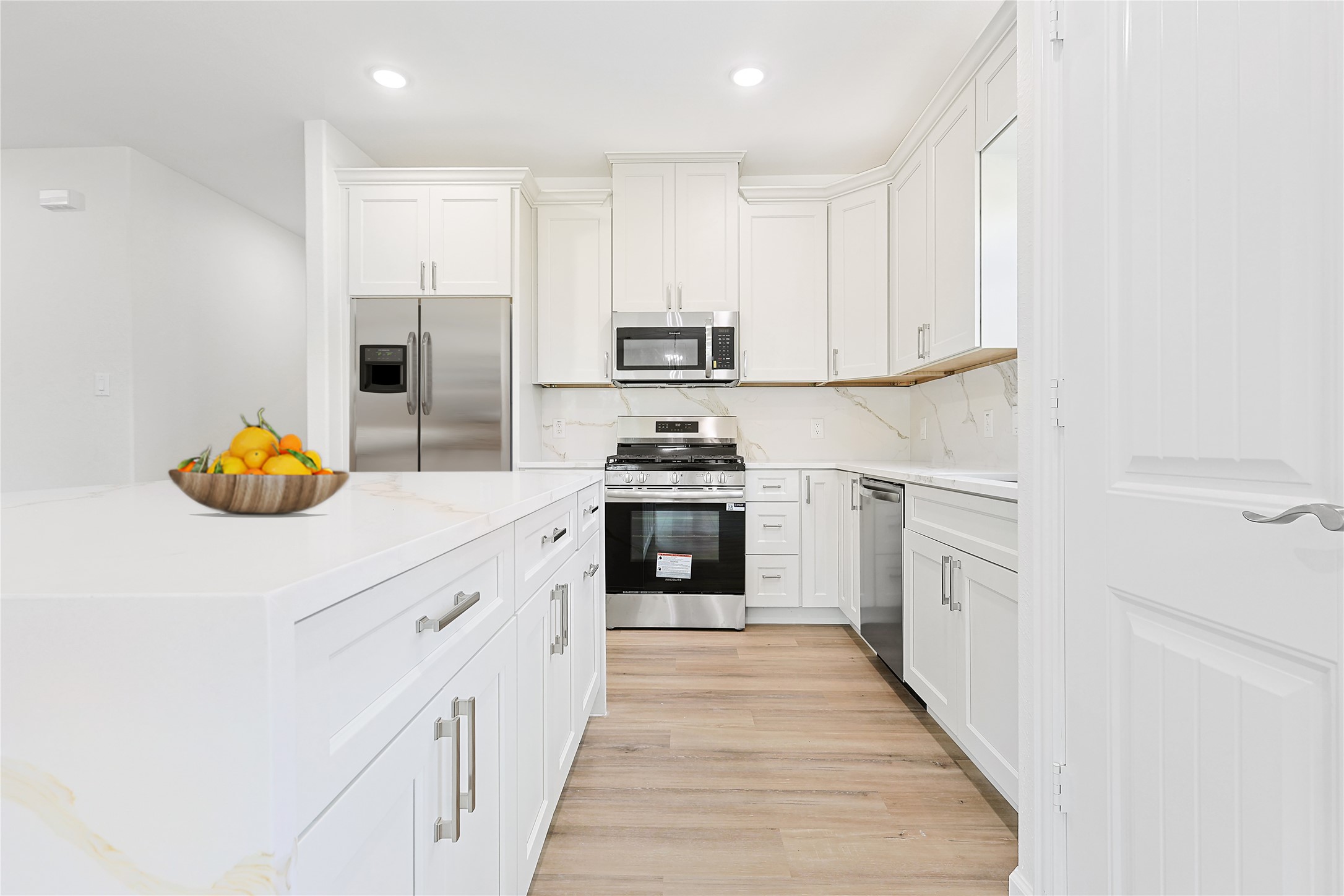 2317 Cedar Street Pearland, TX 77581 - Photo 11 of 33 a kitchen with granite countertop white cabinets and white appliances