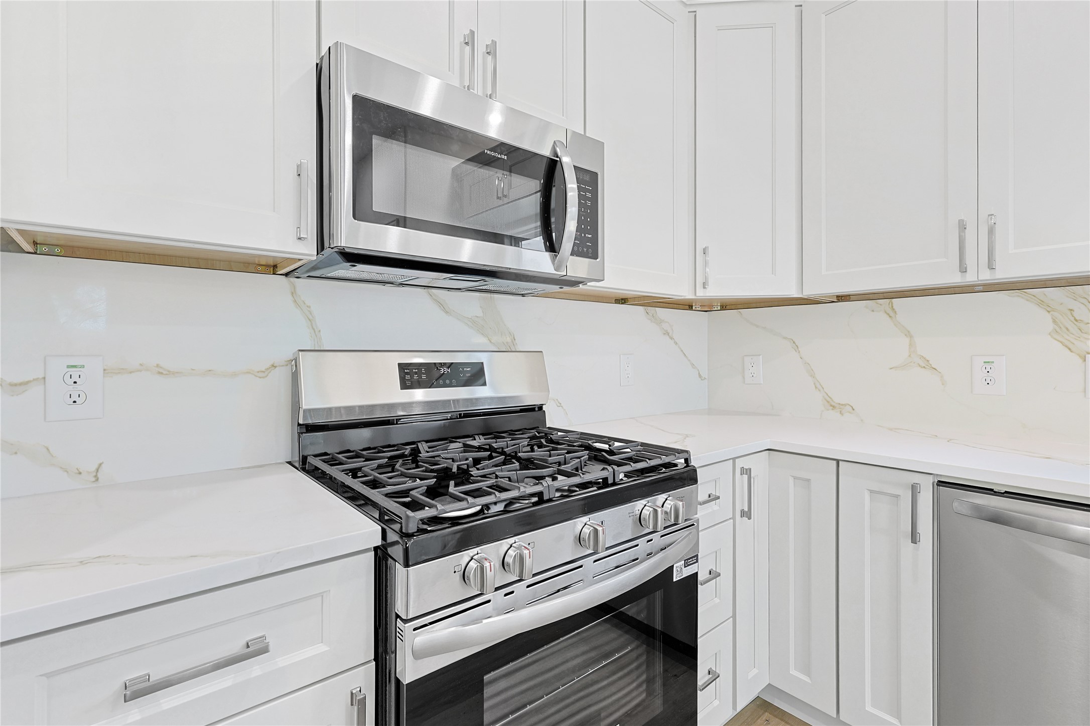 2317 Cedar Street Pearland, TX 77581 - Photo 14 of 33 a kitchen with stainless steel appliances granite countertop a sink and a stove