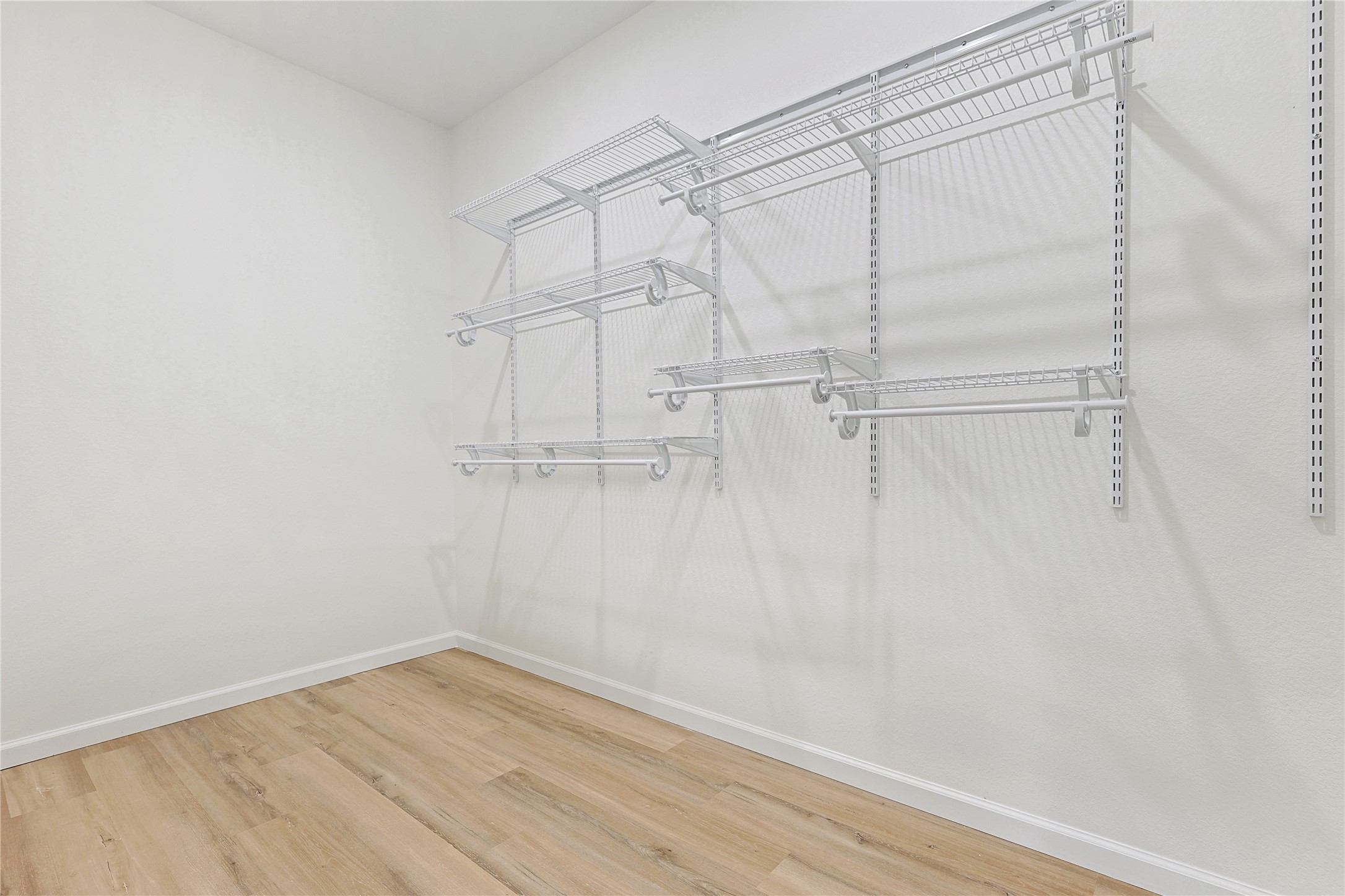 2317 Cedar Street Pearland, TX 77581 - Photo 19 of 33 a view of an empty walk in closet