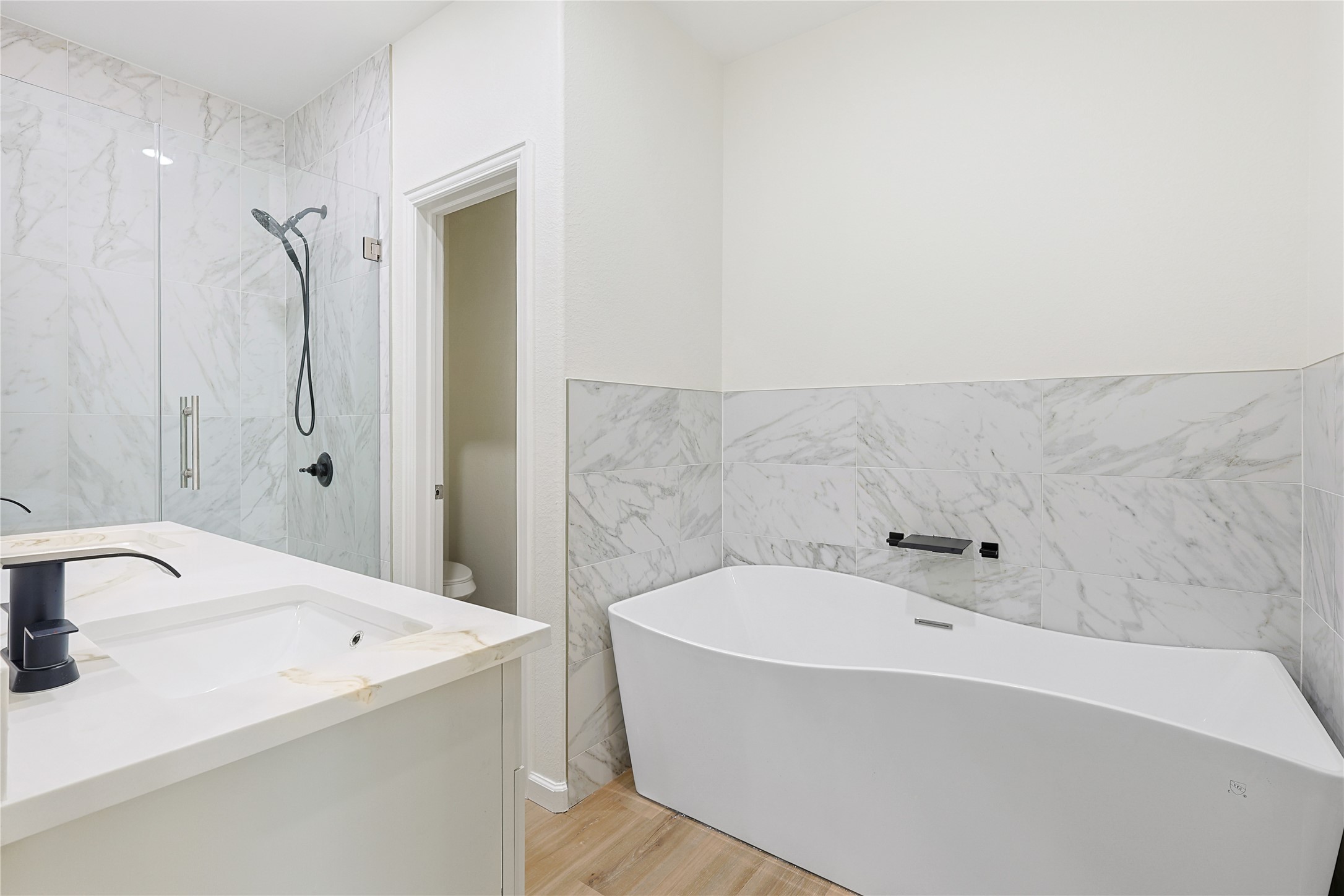 2317 Cedar Street Pearland, TX 77581 - Photo 21 of 33 a bathroom with a bathtub and shower