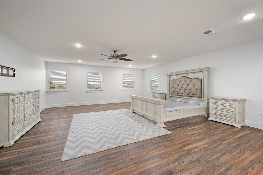 7384 Rector Road Sanger, TX 76266 - Photo 16 of 40 a living room with furniture and a wooden floor