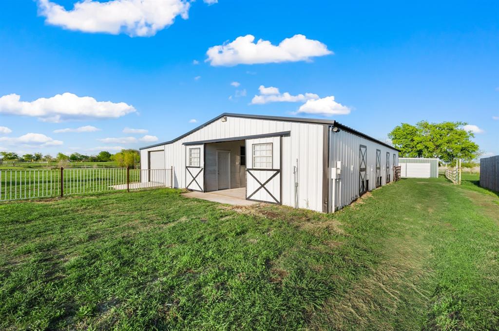 7384 Rector Road Sanger, TX 76266 - Photo 28 of 40 a view of a house with a yard