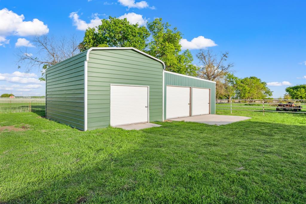 7384 Rector Road Sanger, TX 76266 - Photo 30 of 40 a view of a backyard with a garden