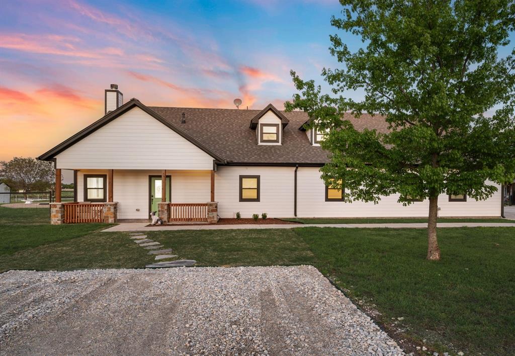 7384 Rector Road Sanger, TX 76266 - Photo 39 of 40 a front view of a house with a garden