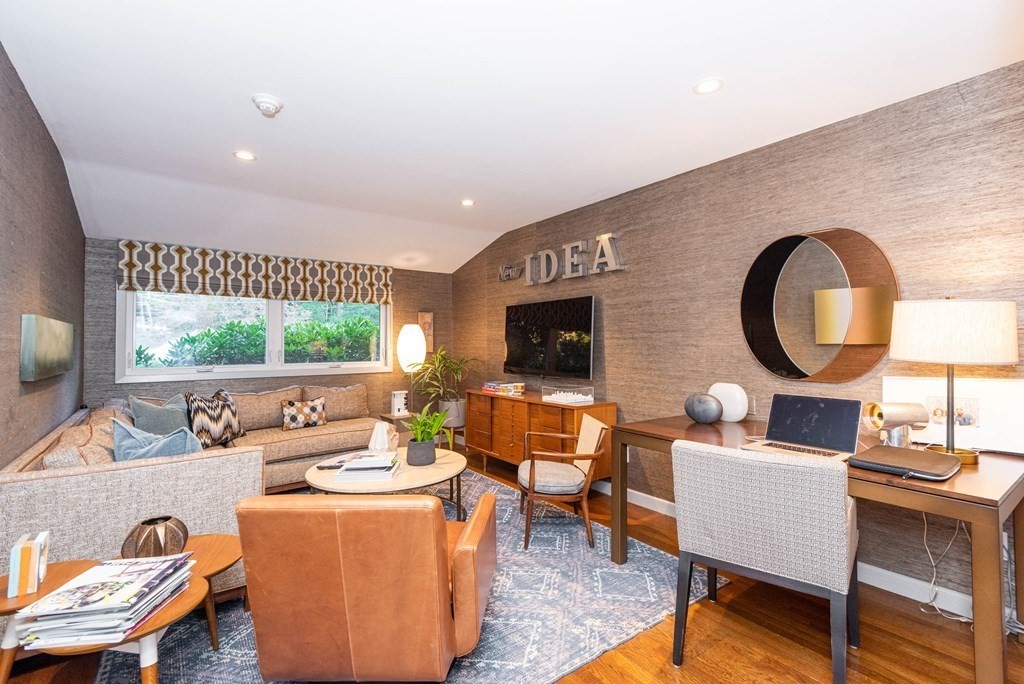 12 Alexandra Road Lynnfield, MA 01940 - Photo 24 of 42 a living room with furniture a large window and a flat screen tv
