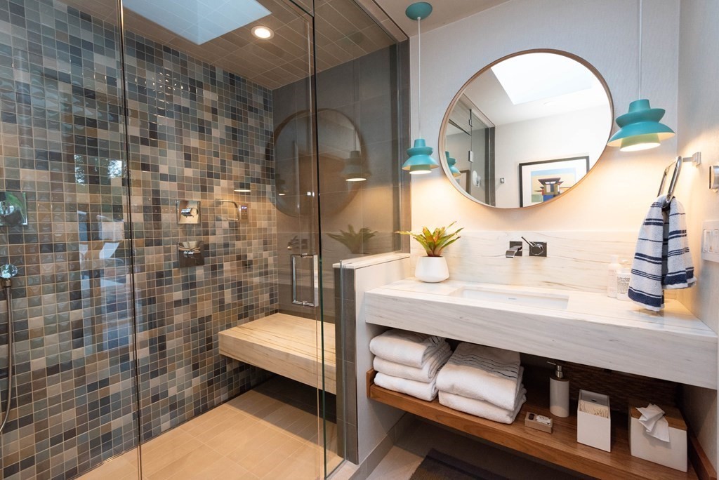 12 Alexandra Road Lynnfield, MA 01940 - Photo 26 of 42 a bathroom with a sink a mirror and a shower