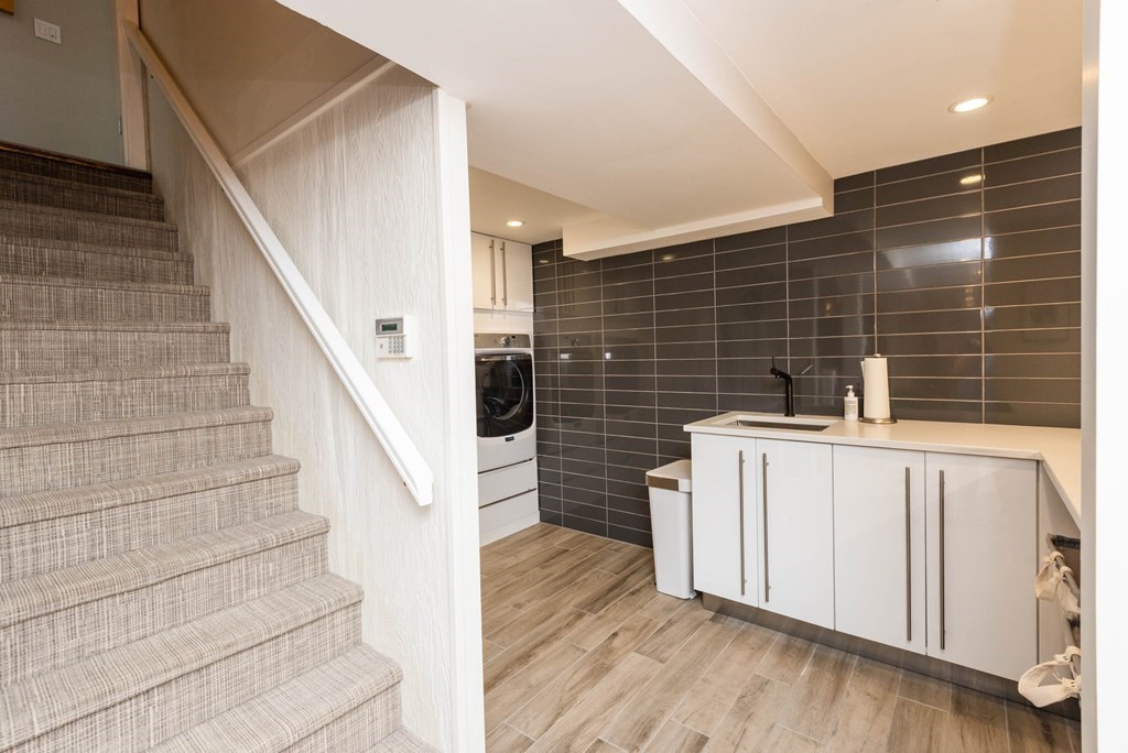 12 Alexandra Road Lynnfield, MA 01940 - Photo 28 of 42 a view of entryway with stairs and wooden floor