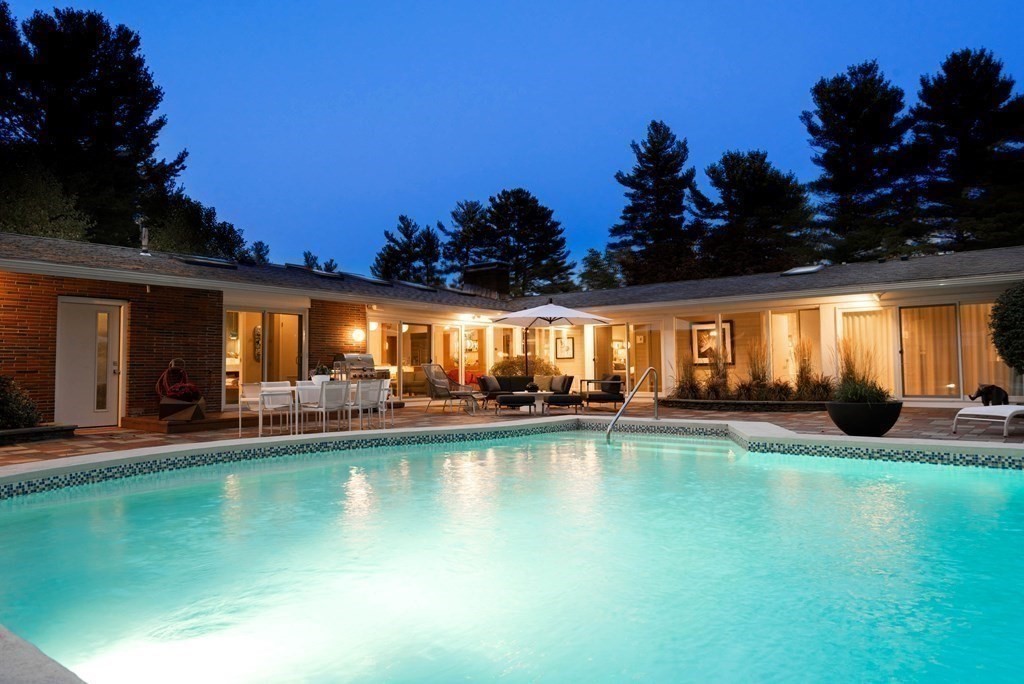 12 Alexandra Road Lynnfield, MA 01940 - Photo 39 of 42 a view of a swimming pool with lounge chairs in patio
