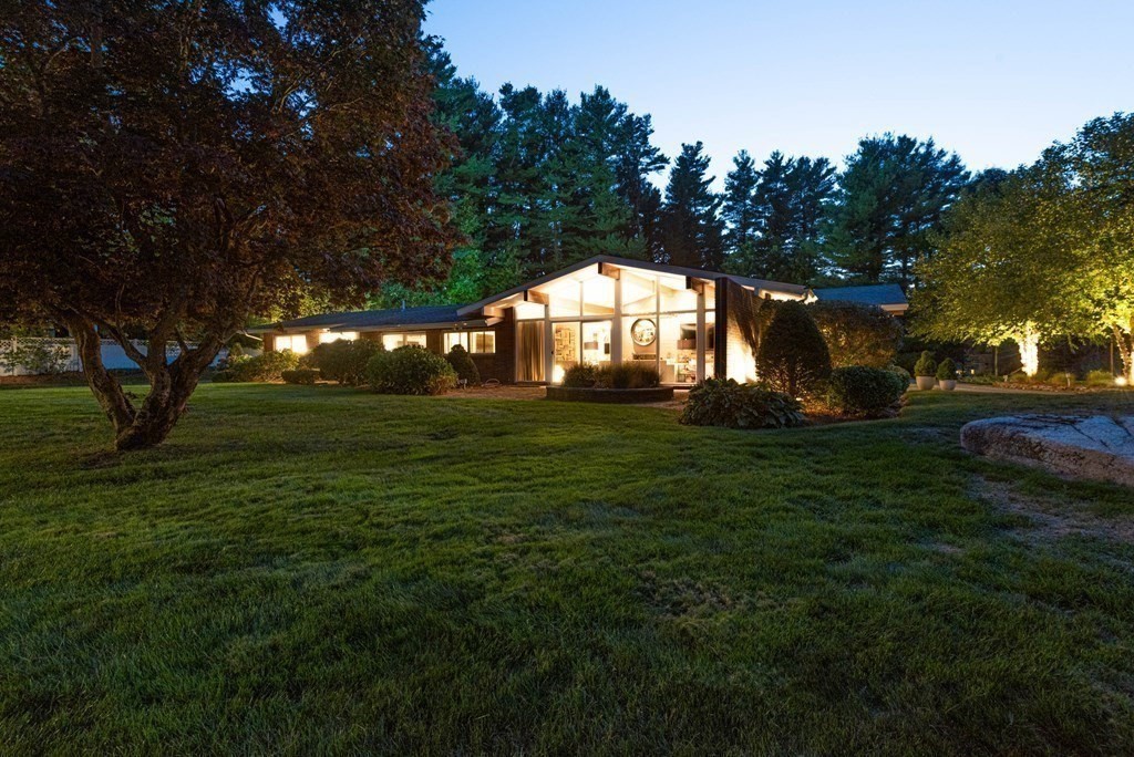 12 Alexandra Road Lynnfield, MA 01940 - Photo 41 of 42 a large yard with lots of green space and trees in the background