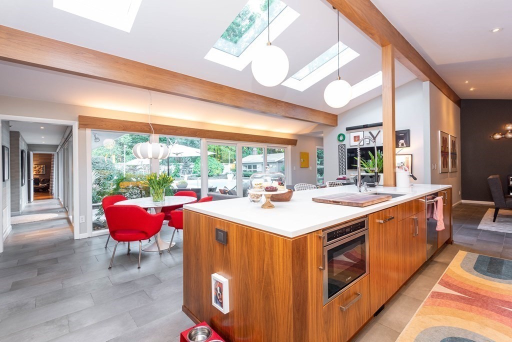 12 Alexandra Road Lynnfield, MA 01940 - Photo 10 of 42 a view of a kitchen with kitchen island a sink and a large window
