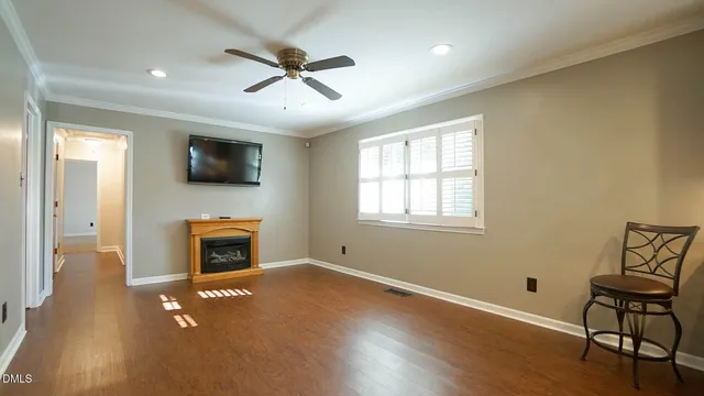 a living room with furniture fireplace and flat screen tv
