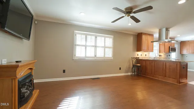 a view of kitchen with a sink microwave and window