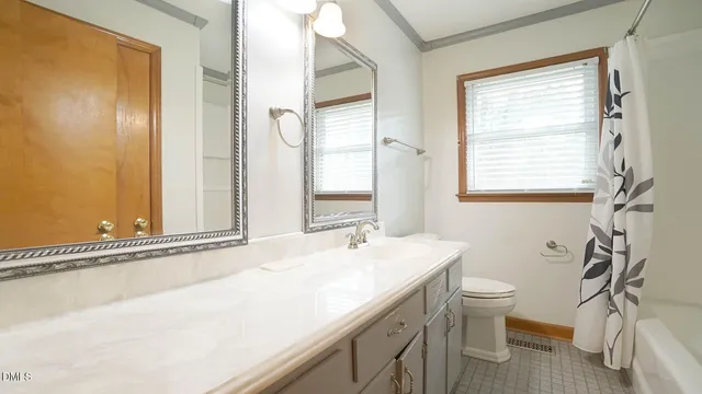 a bathroom with a shower and toilet