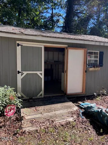 a view of a room with wooden ceiling