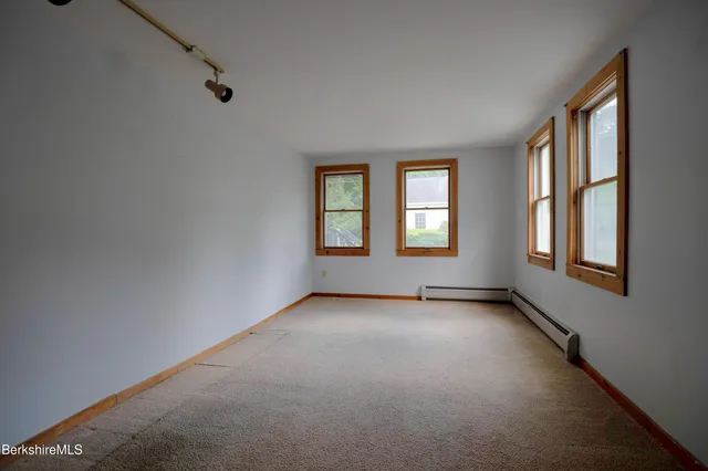 a view of a bathroom with tub and shower