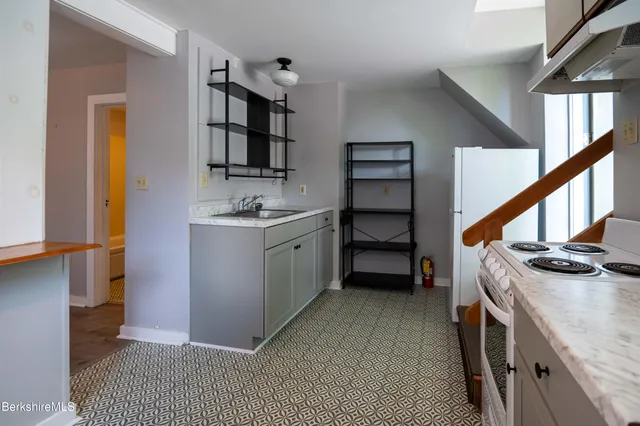 a bathroom with a toilet a sink and bathtub