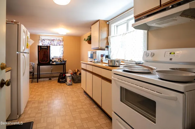 a kitchen with stainless steel appliances a sink and a stove