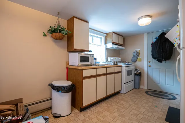 a view of a hallway with a room and a livingroom view