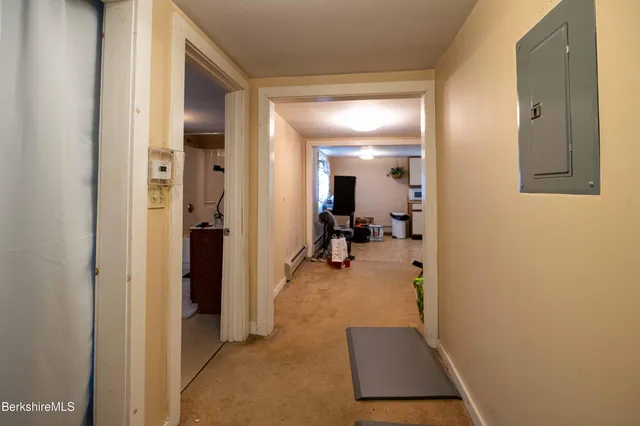 a room with gym equipment and a mirror