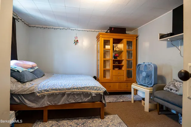 a view of living room with furniture and a flat screen tv
