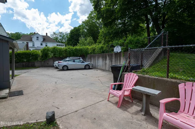 a view of backyard with seating space