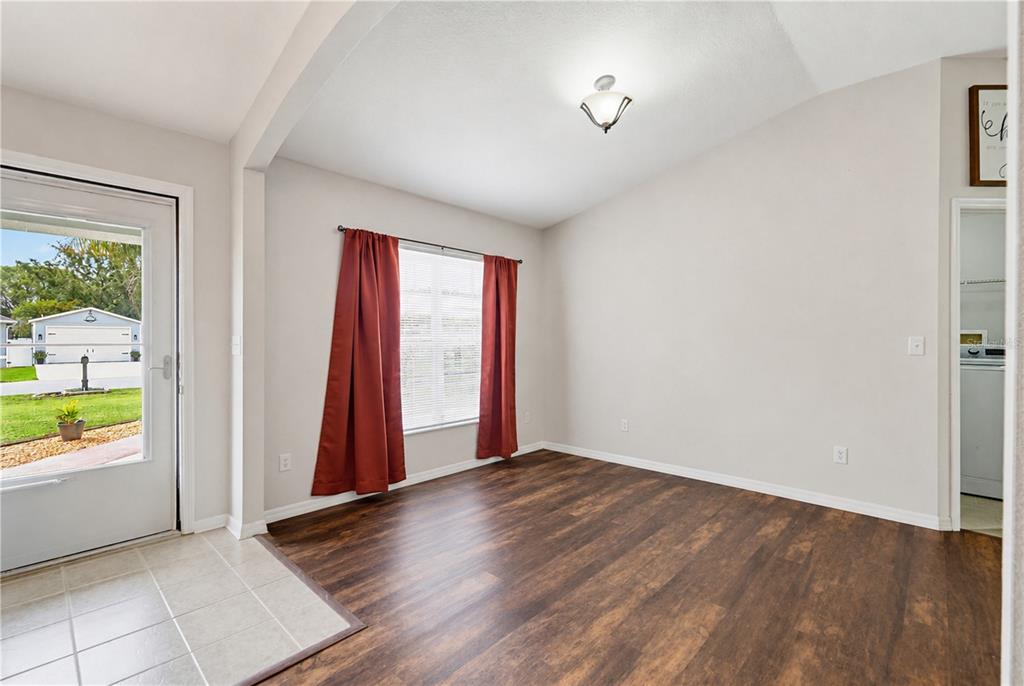 3497 Chadwick Avenue Spring Hill, FL 34609 - Photo 22 of 47 wooden floor in an empty room with a window