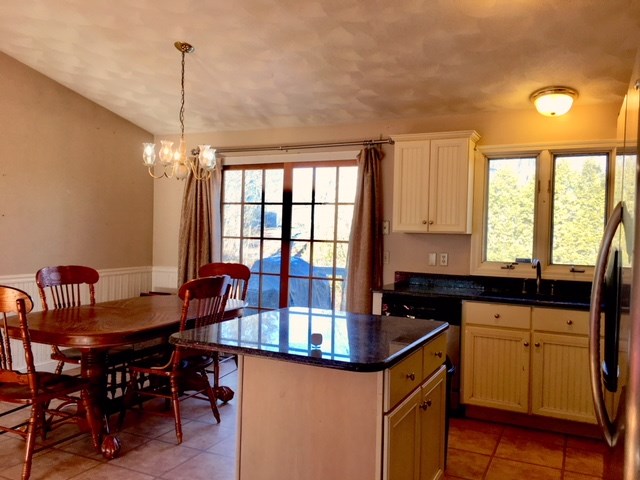 Kitchen open to Dining/French door to back deck