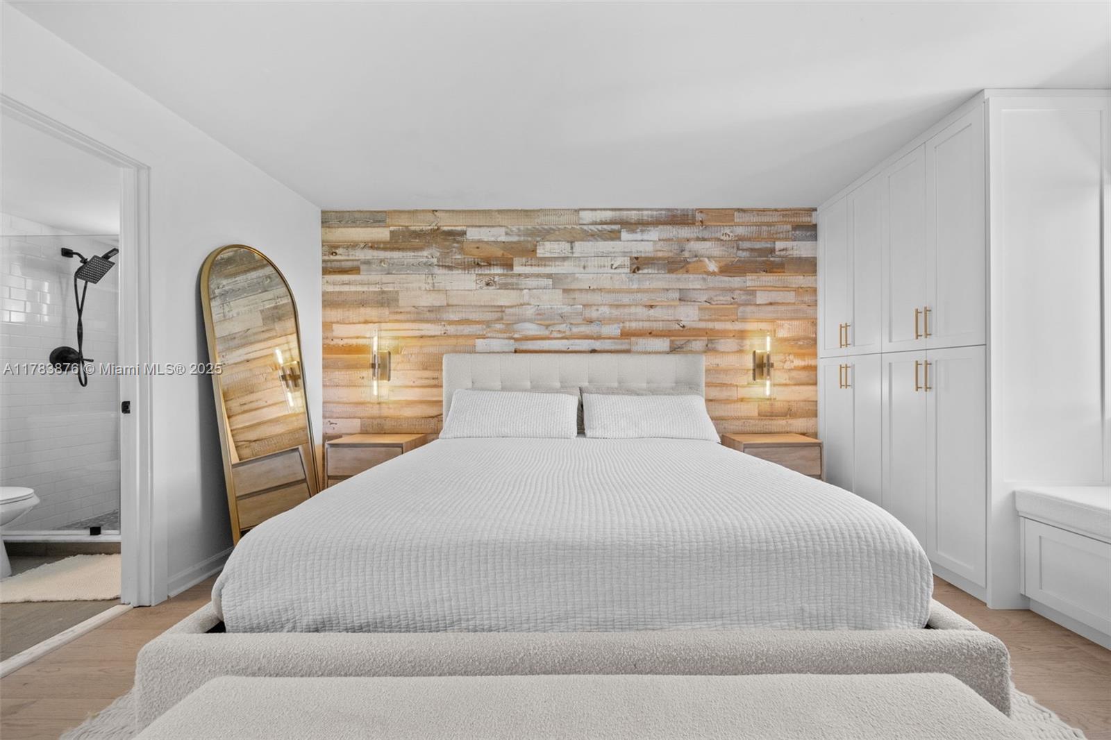 1401 Bay Road, Unit 506 Miami Beach, FL 33139 - Photo 11 of 28 a bedroom with a bed and a painting on the wall