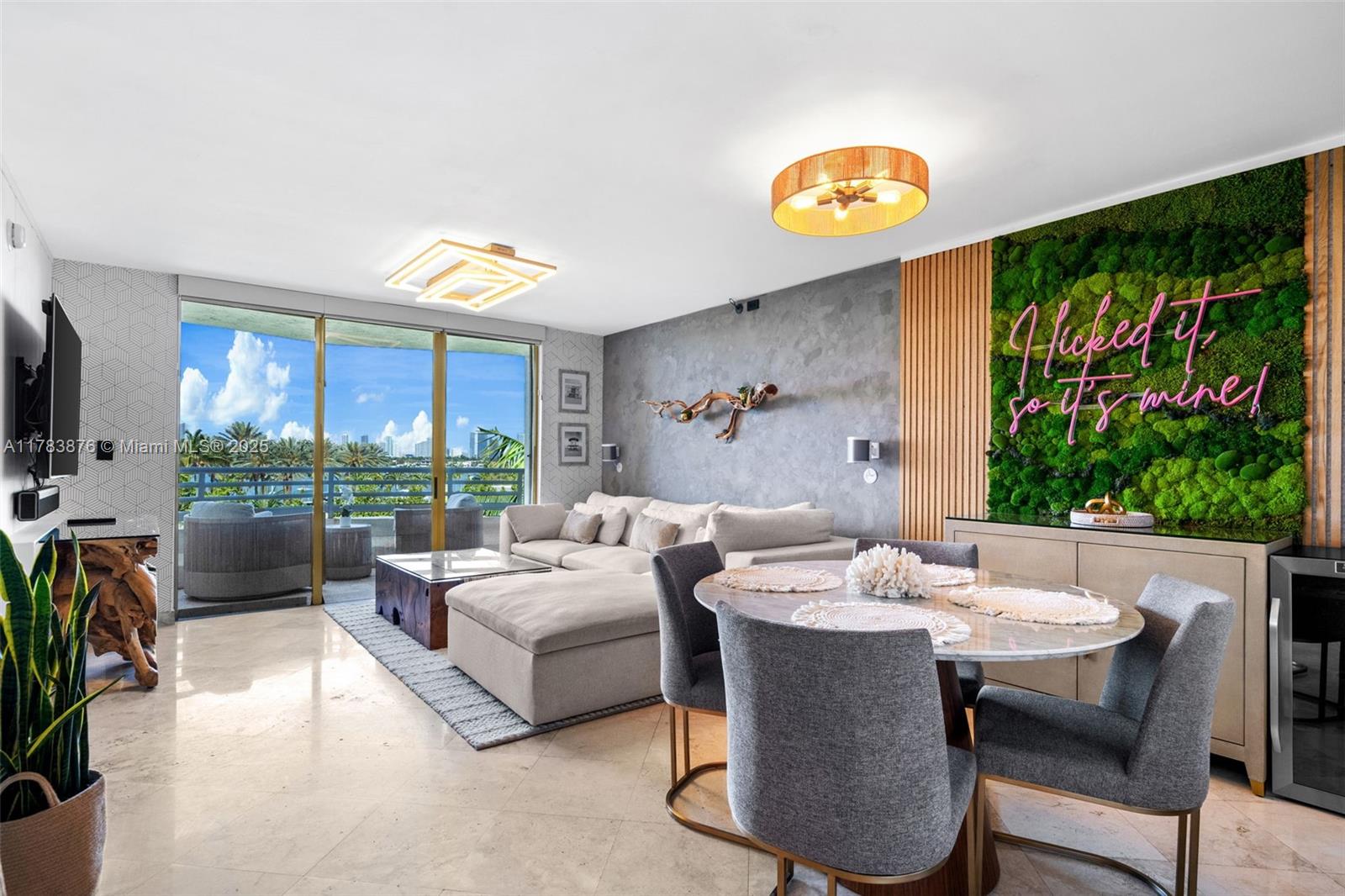 1401 Bay Road, Unit 506 Miami Beach, FL 33139 - Photo 2 of 28 a living room with furniture and a large window