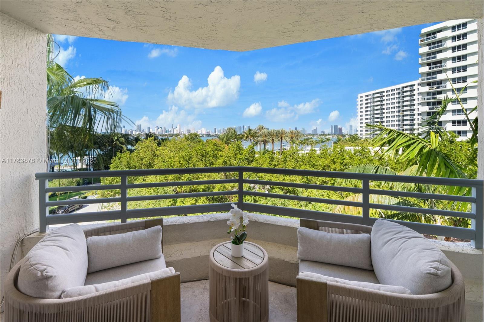 1401 Bay Road, Unit 506 Miami Beach, FL 33139 - Photo 21 of 28 a roof deck with couch and a potted plant