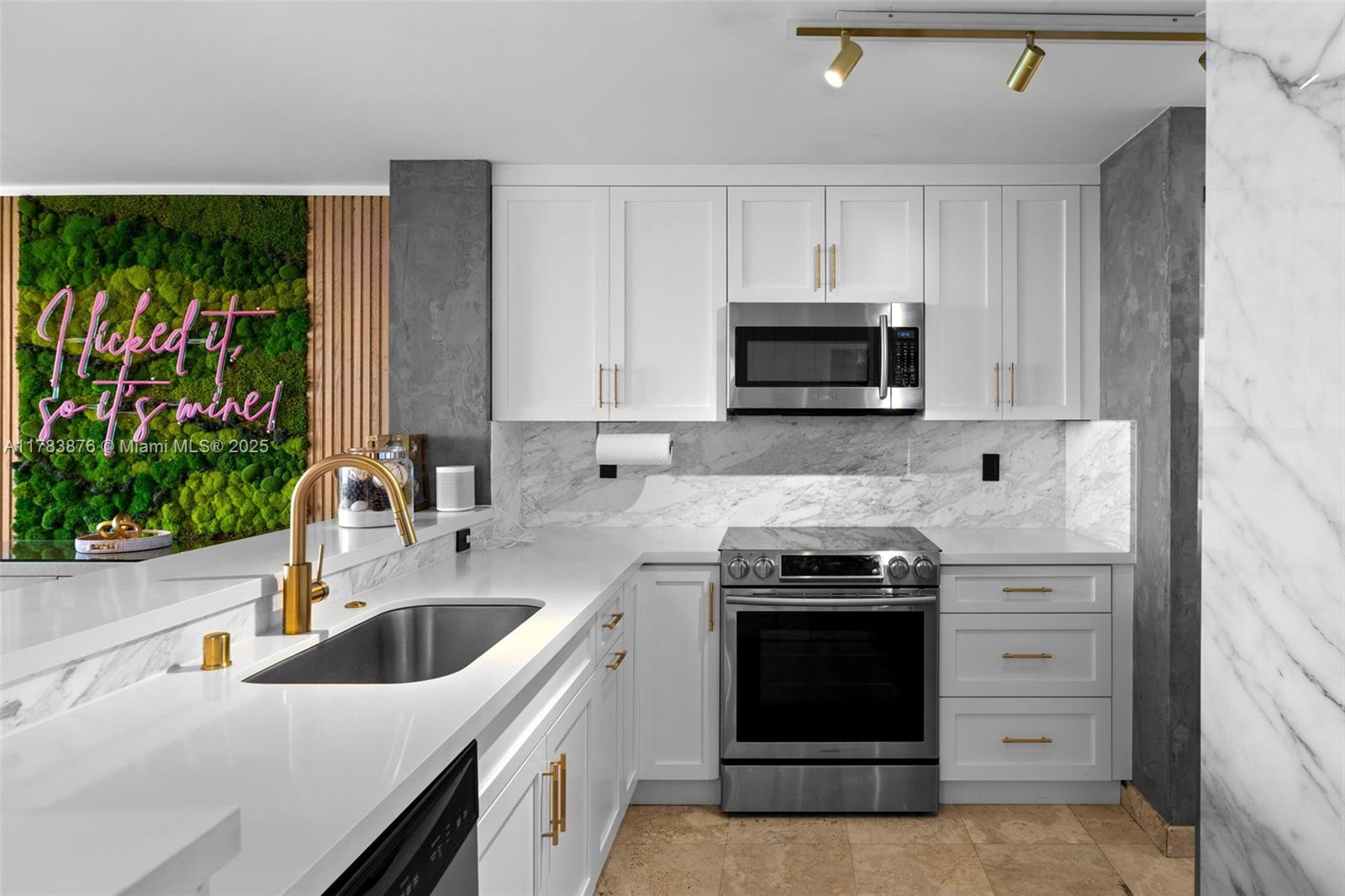 1401 Bay Road, Unit 506 Miami Beach, FL 33139 - Photo 7 of 28 a kitchen with a stove and a sink