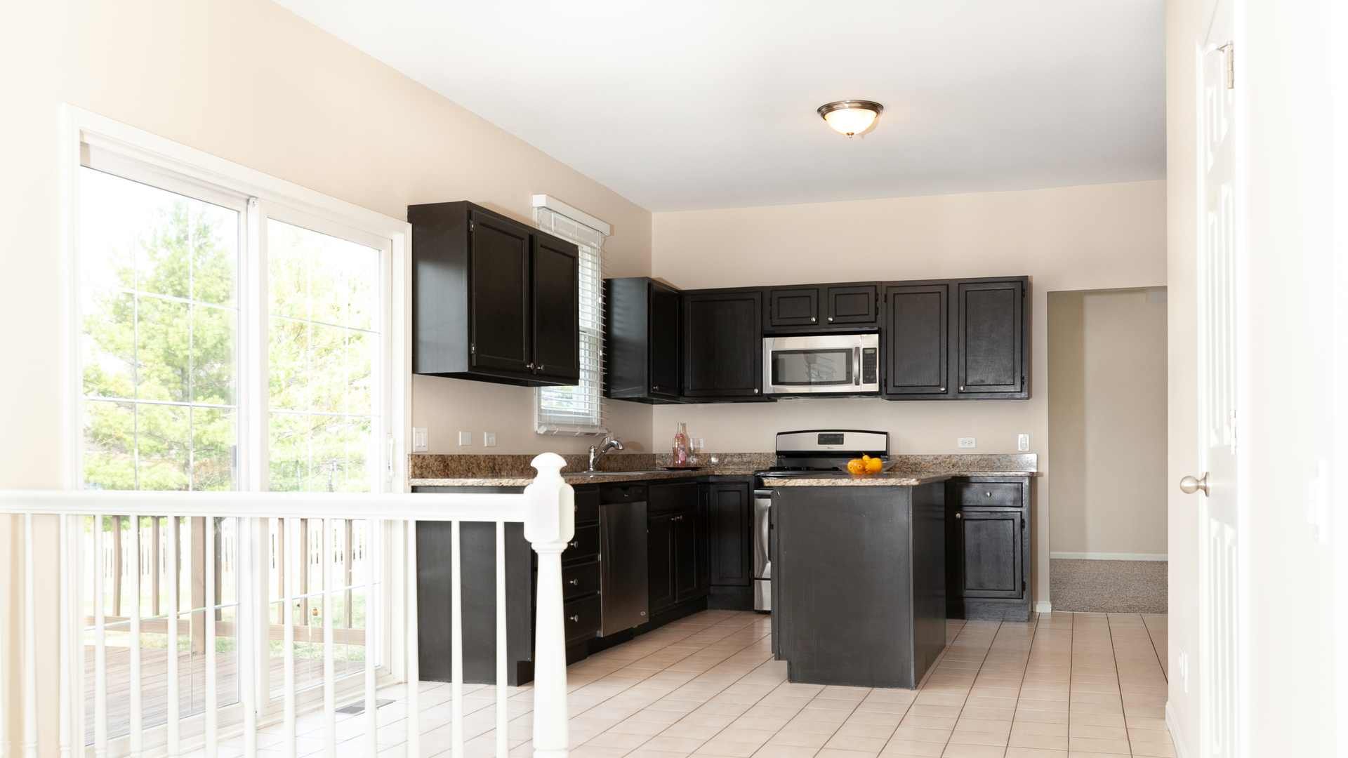24856 Vermette Road Plainfield, IL 60585 - Photo 4 of 18 a kitchen with stainless steel appliances a stove a sink and a refrigerator