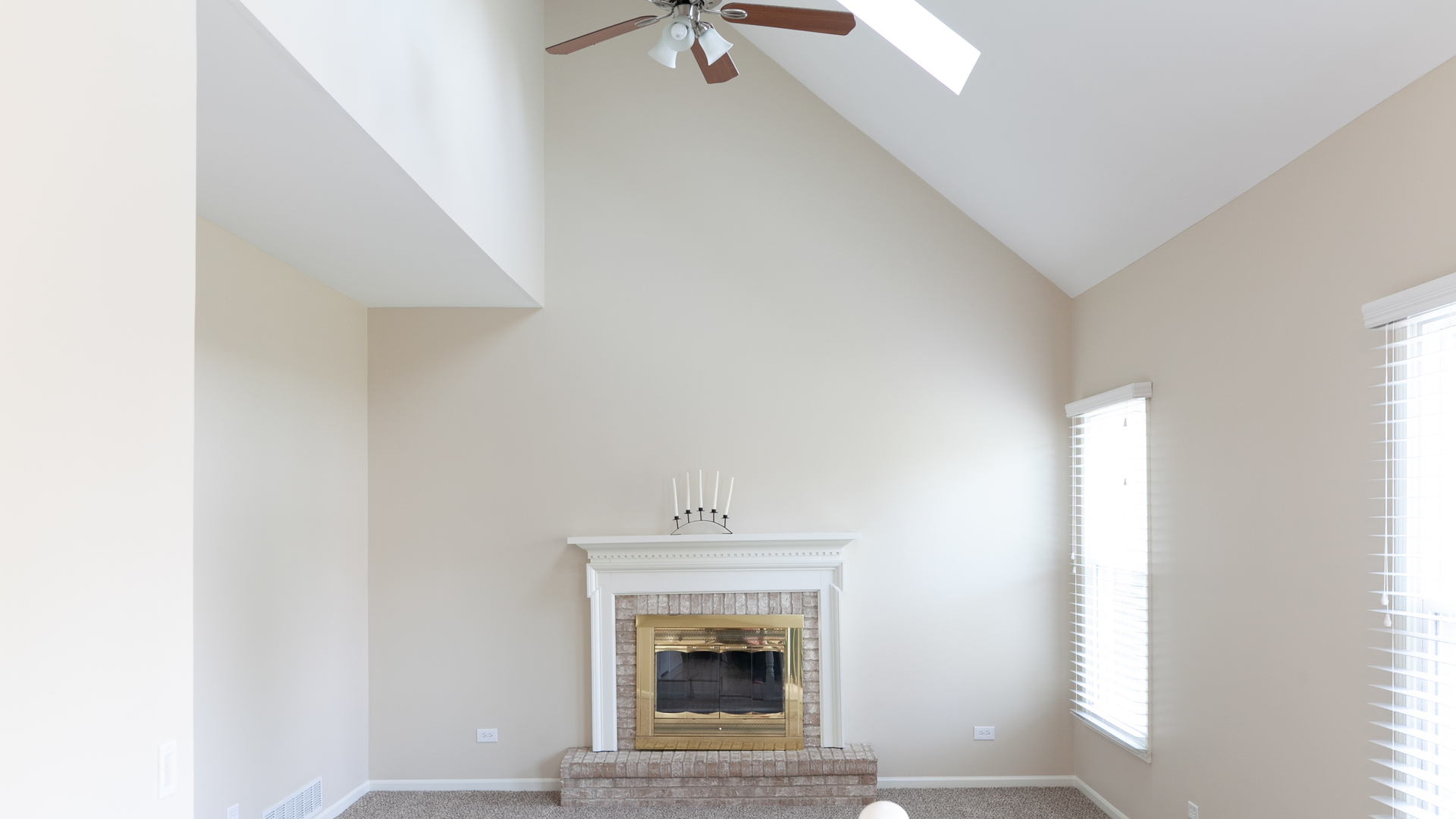24856 Vermette Road Plainfield, IL 60585 - Photo 6 of 18 a living room with a fireplace and a window