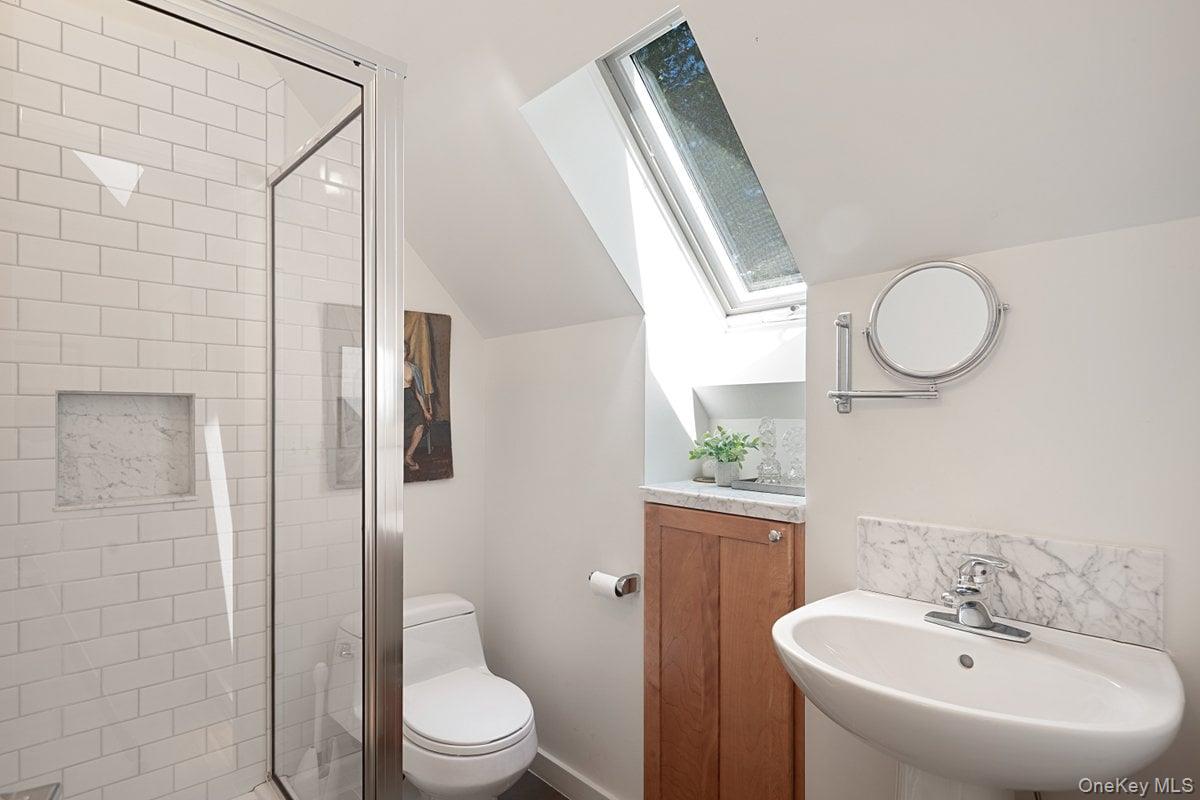 1821 Spring Valley Road Ossining, NY 10562 - Photo 35 of 48 Full bath on the second floor with a stand-up shower, window, and pedestal sink is shared by the two bedrooms.
