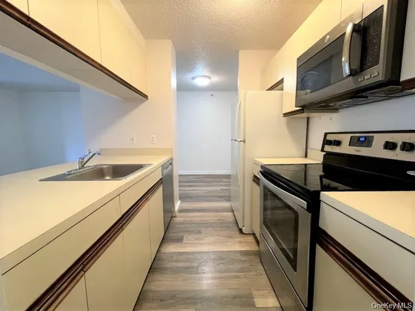 a kitchen with a stove and a microwave