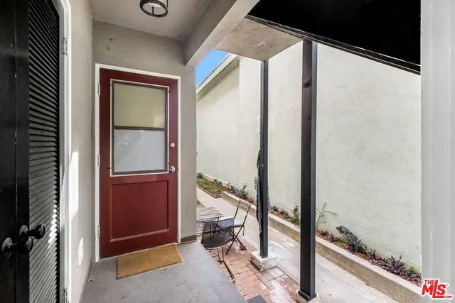 a view of front door and bedroom