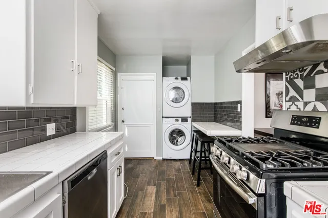 a kitchen with a stove and a refrigerator