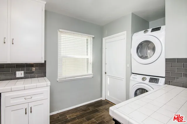 a view of a kitchen with washer and dryer