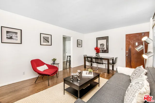 a living room with furniture and a rug