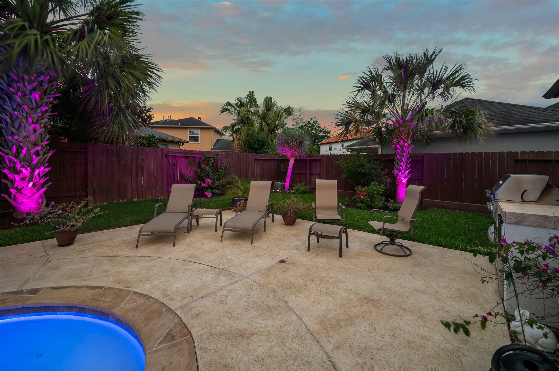 2127 Thicket Ridge Lane Houston, TX 77077 - Photo 41 of 48 The east side of the pool and deck area shows palms on this side of the large back yard.