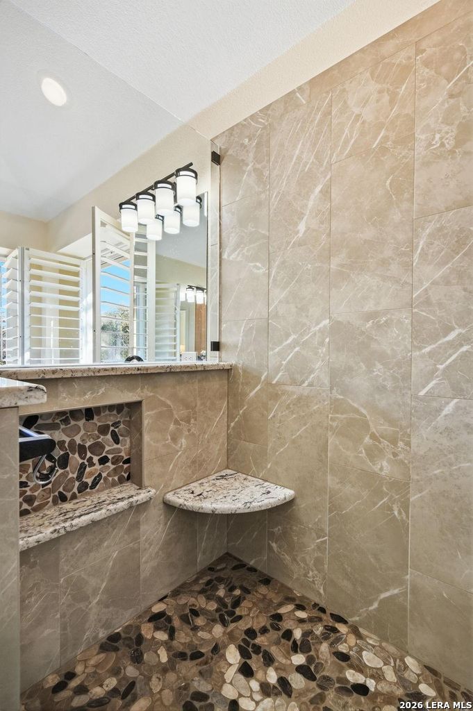 318 River Ridge Boerne, TX 78006 - Photo 24 of 46 a bathroom with a sink a toilet and a shower