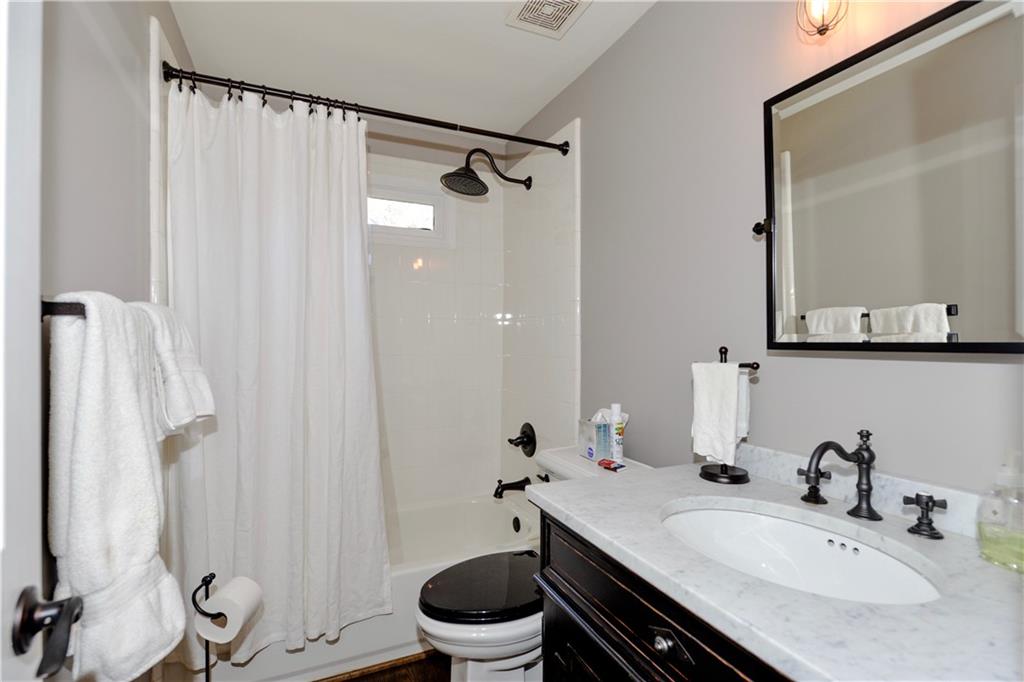 265 Windsor Gate Cove Northeast Atlanta, GA 30342 - Photo 13 of 62 a bathroom with a sink toilet and shower