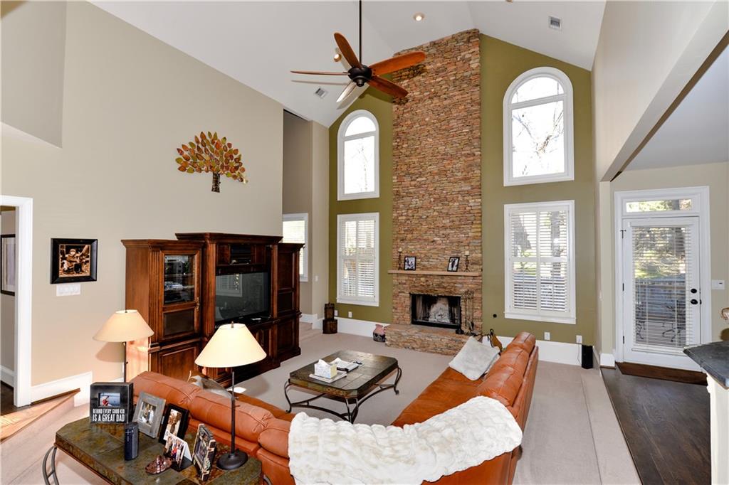 265 Windsor Gate Cove Northeast Atlanta, GA 30342 - Photo 15 of 62 a living room with furniture and wooden floor