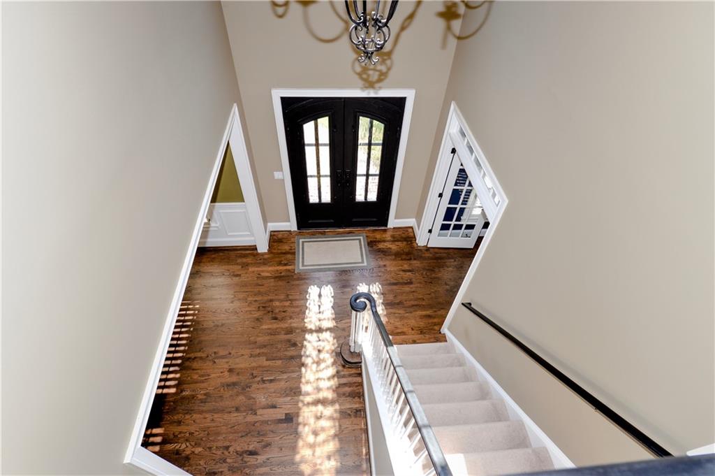 265 Windsor Gate Cove Northeast Atlanta, GA 30342 - Photo 26 of 62 a view of entryway and hall with wooden floor