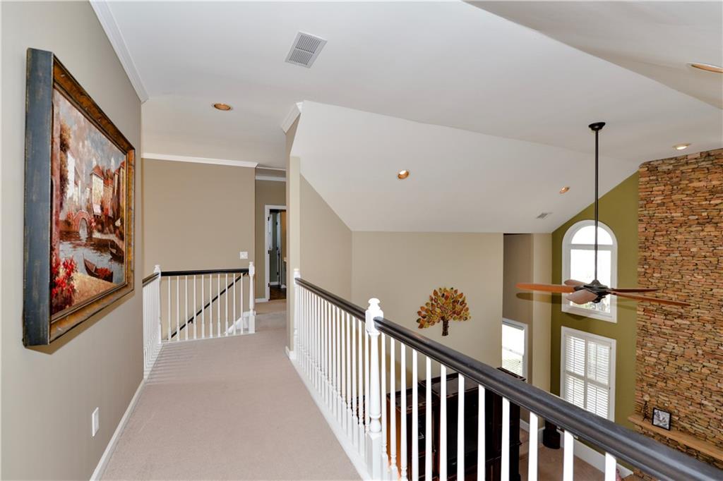 265 Windsor Gate Cove Northeast Atlanta, GA 30342 - Photo 29 of 62 a view of a hallway with stairs