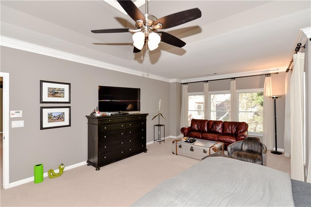 265 Windsor Gate Cove Northeast Atlanta, GA 30342 - Photo 31 of 62 a living room with furniture and a flat screen tv