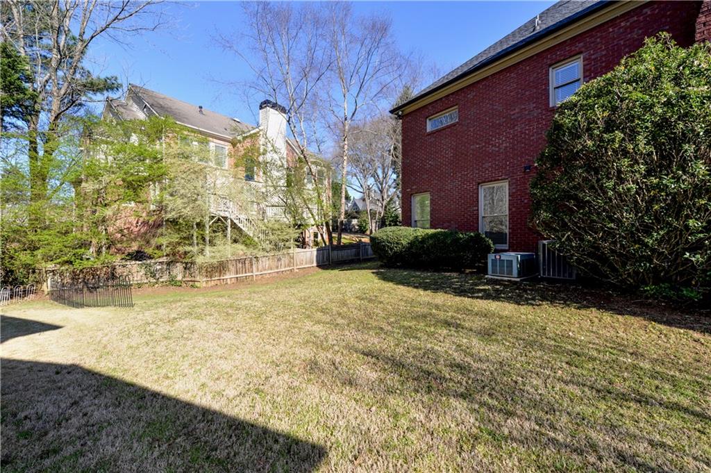 265 Windsor Gate Cove Northeast Atlanta, GA 30342 - Photo 53 of 62 a view of back yard of the house