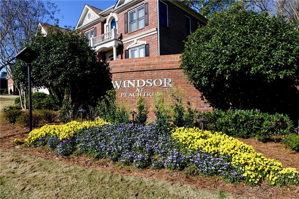 265 Windsor Gate Cove Northeast Atlanta, GA 30342 - Photo 57 of 62 a sign that is sitting in front of flowers