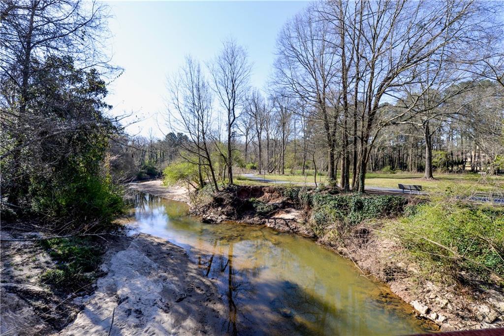 265 Windsor Gate Cove Northeast Atlanta, GA 30342 - Photo 59 of 62 a view of a park with large trees