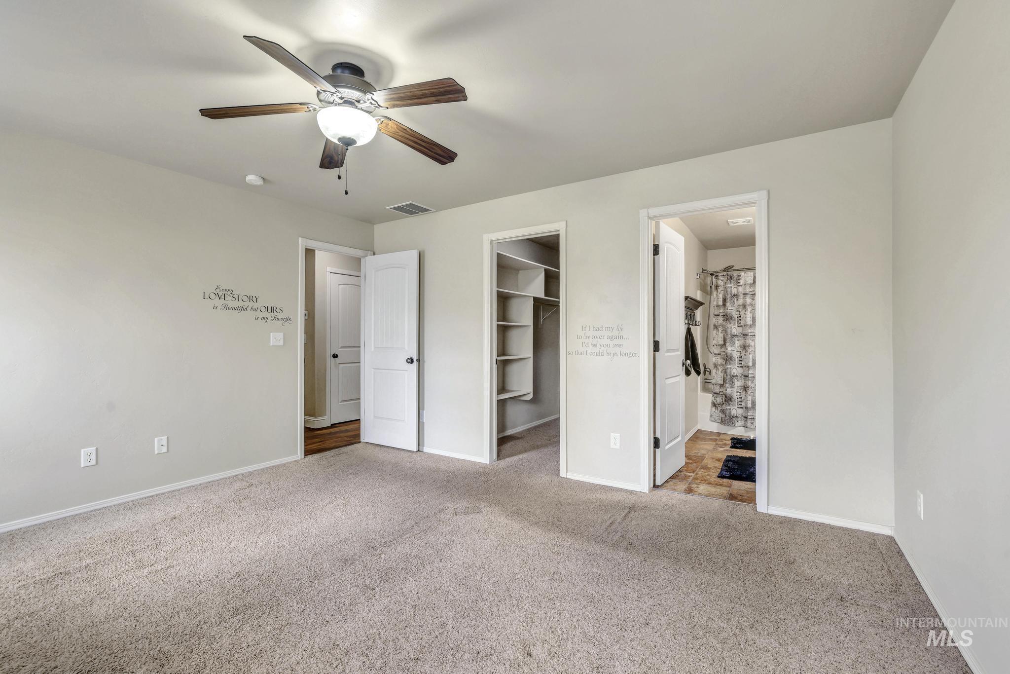446 Noble Street Twin Falls, ID 83301 - Photo 19 of 42 Bedroom featuring soft carpet flooring, a ceiling fan with light fixture, and light-colored walls